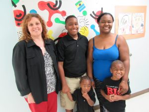 Pictured, SEH Program Manager, Christina Hewitt, with Amanda J. and family -- a participant in SEH.
